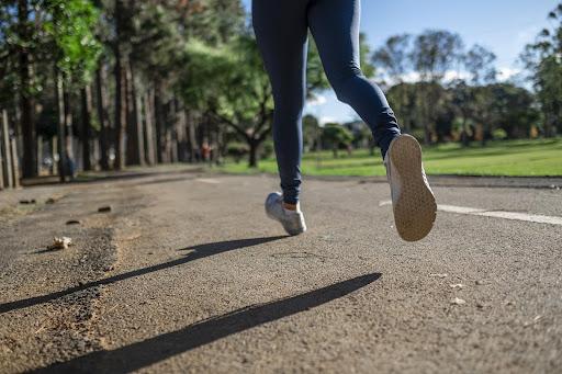 photo of person's feet on a run